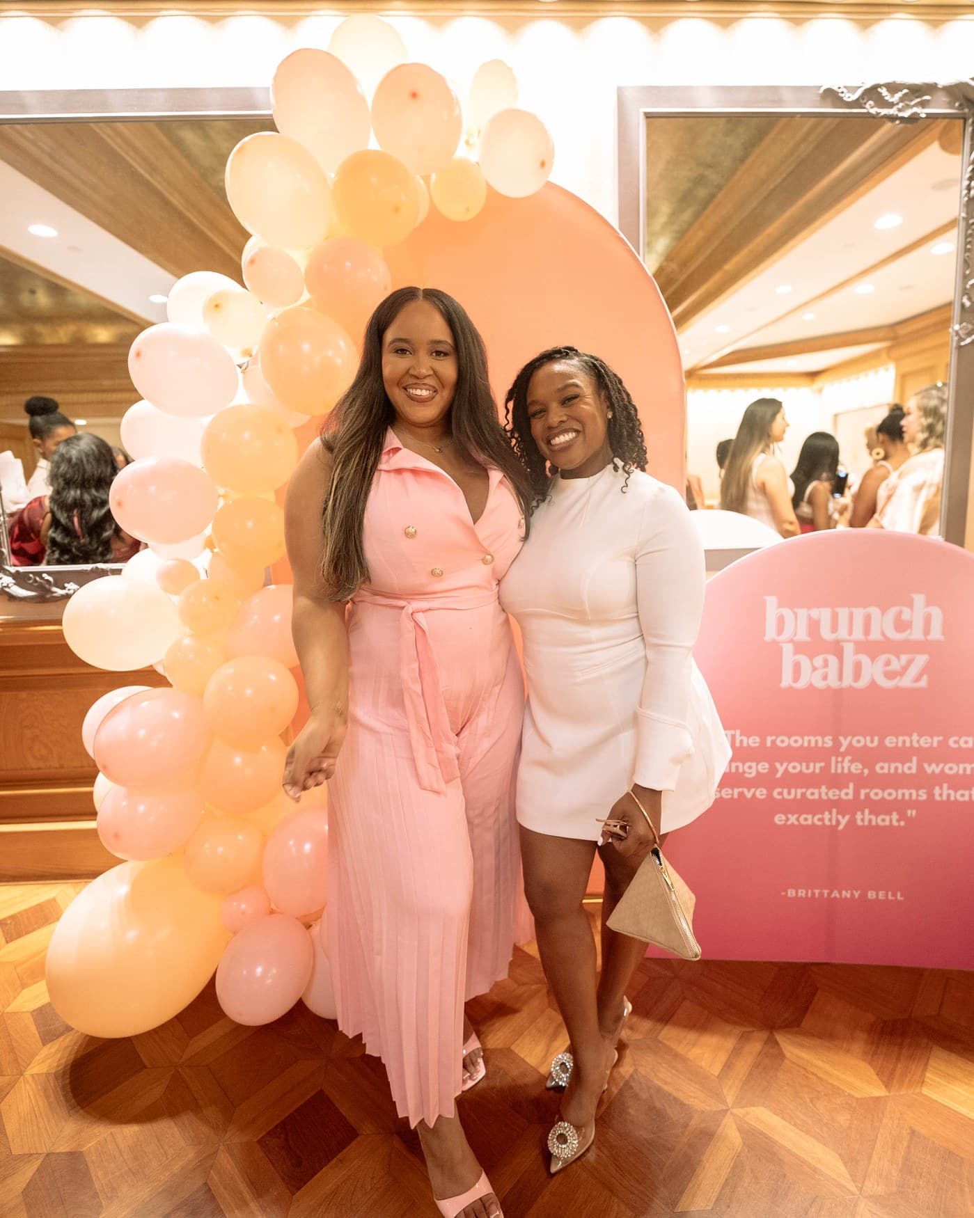Guests arriving at the Brunch Babez backdrop.