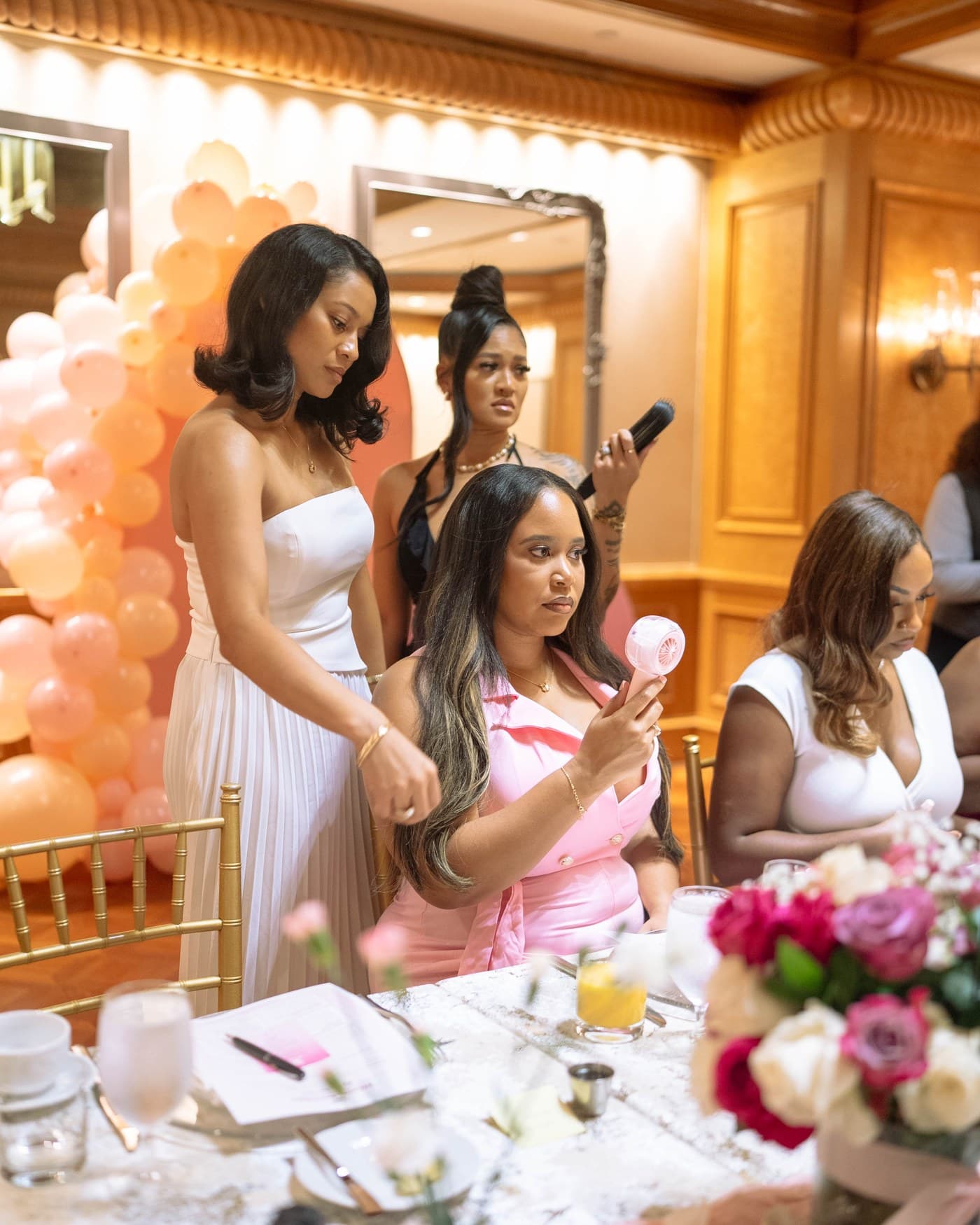 Place settings, florals and gifting at the Brunch Babez table at the Four Seasons Atlanta.