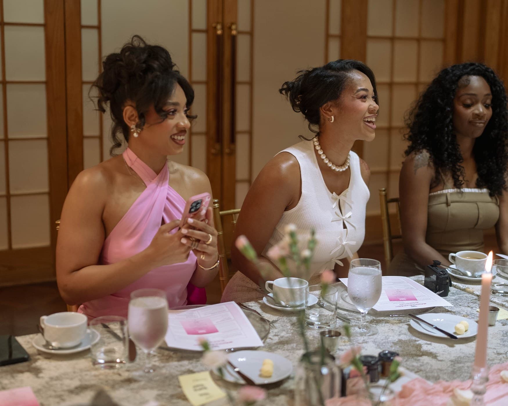 Three guests seated together at the Brunch Babez table, Four Seasons Hotel Atlanta.