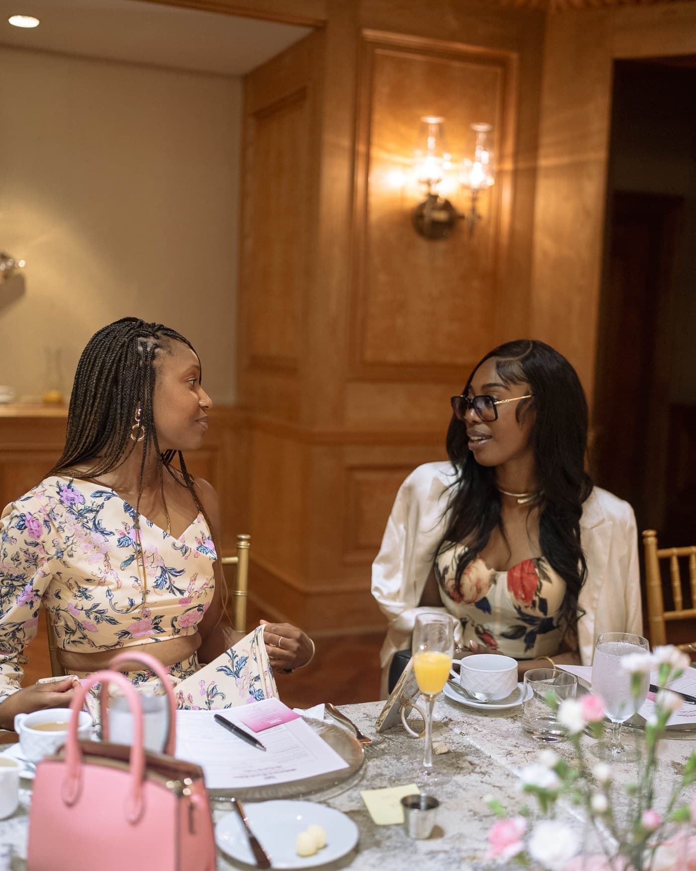 Two guests in conversation across the brunch table at the Four Seasons Atlanta.